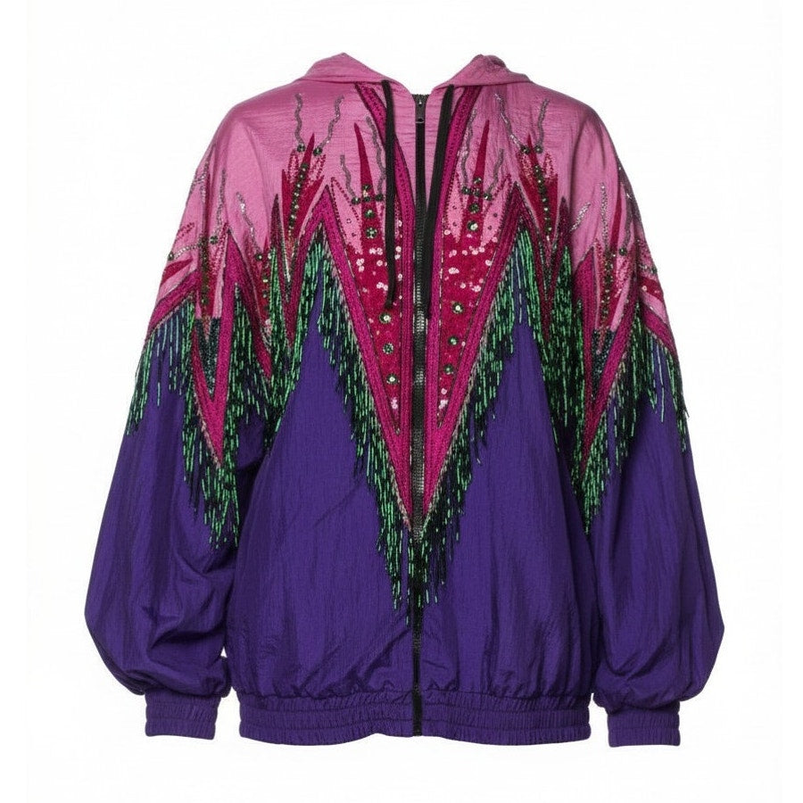 A purple and magenta windbreaker jacket with green fringe and sequined mountain-like patterns on the front, shown against a plain white background.